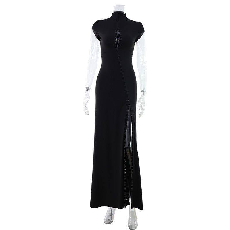 High-necked, floor-length gown with cutouts at the chest and a high slit.