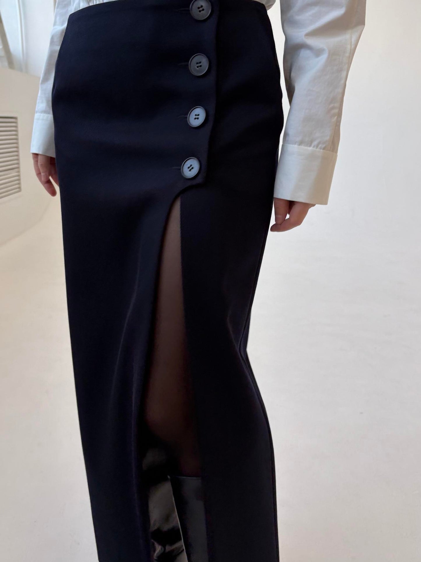 Navy blue asymmetrical button-down skirt, corset, and shirt three-piece set